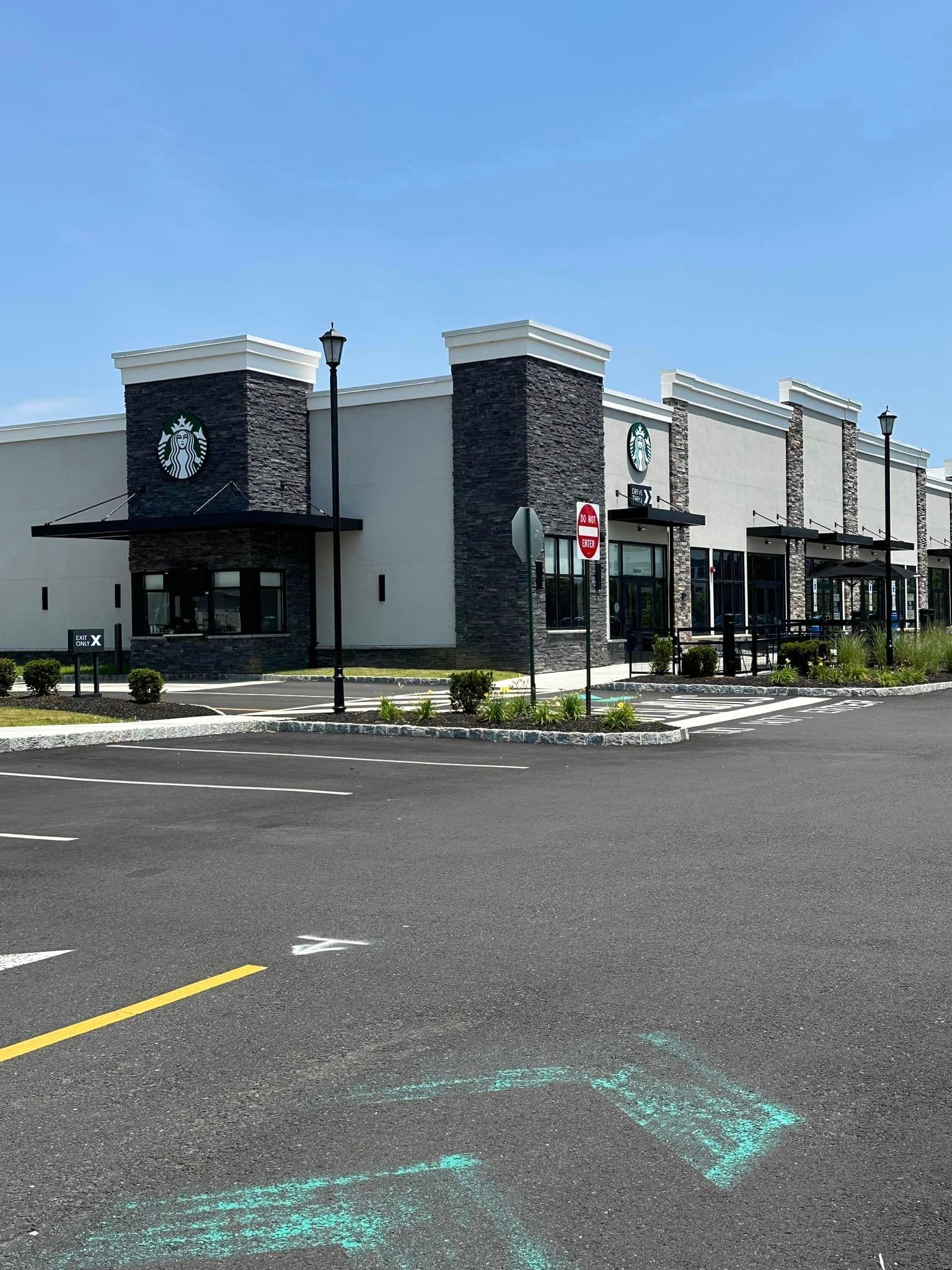 A large building with a starbucks logo on it
