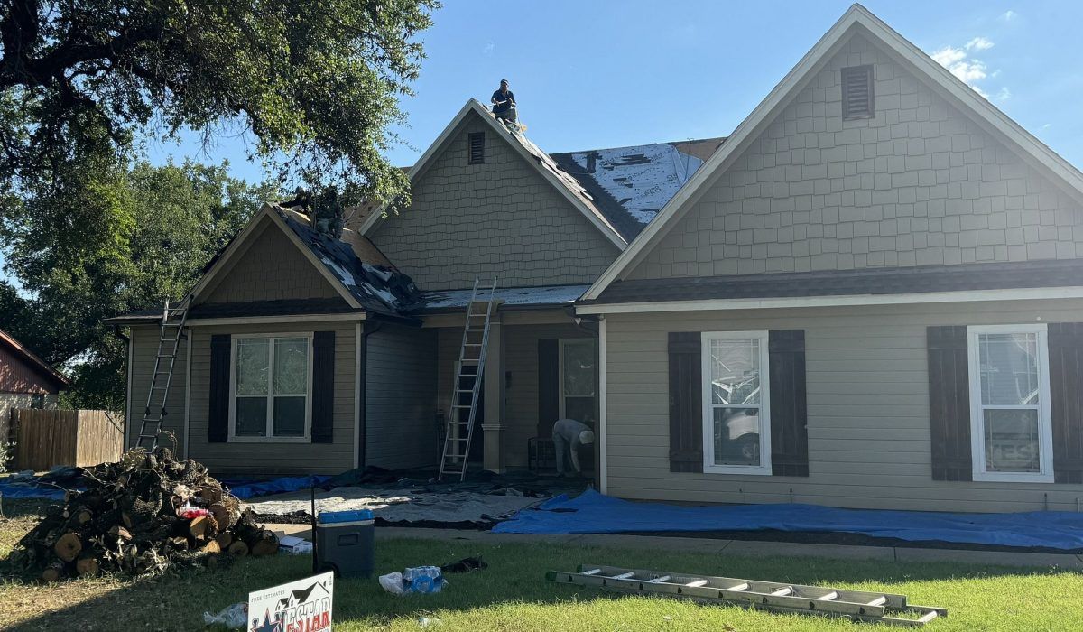 A house is being remodeled with a new roof.