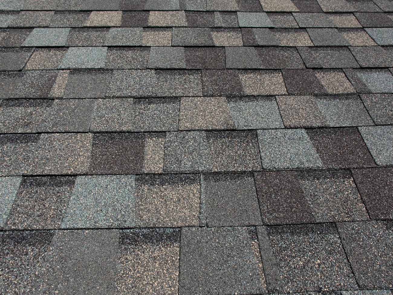 A close up of a roof with shingles on it.