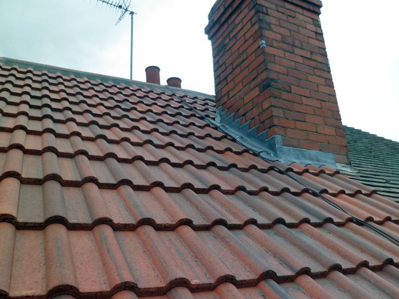 A roof with a chimney on top of it