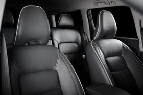 black leather seats in a car with white stitching