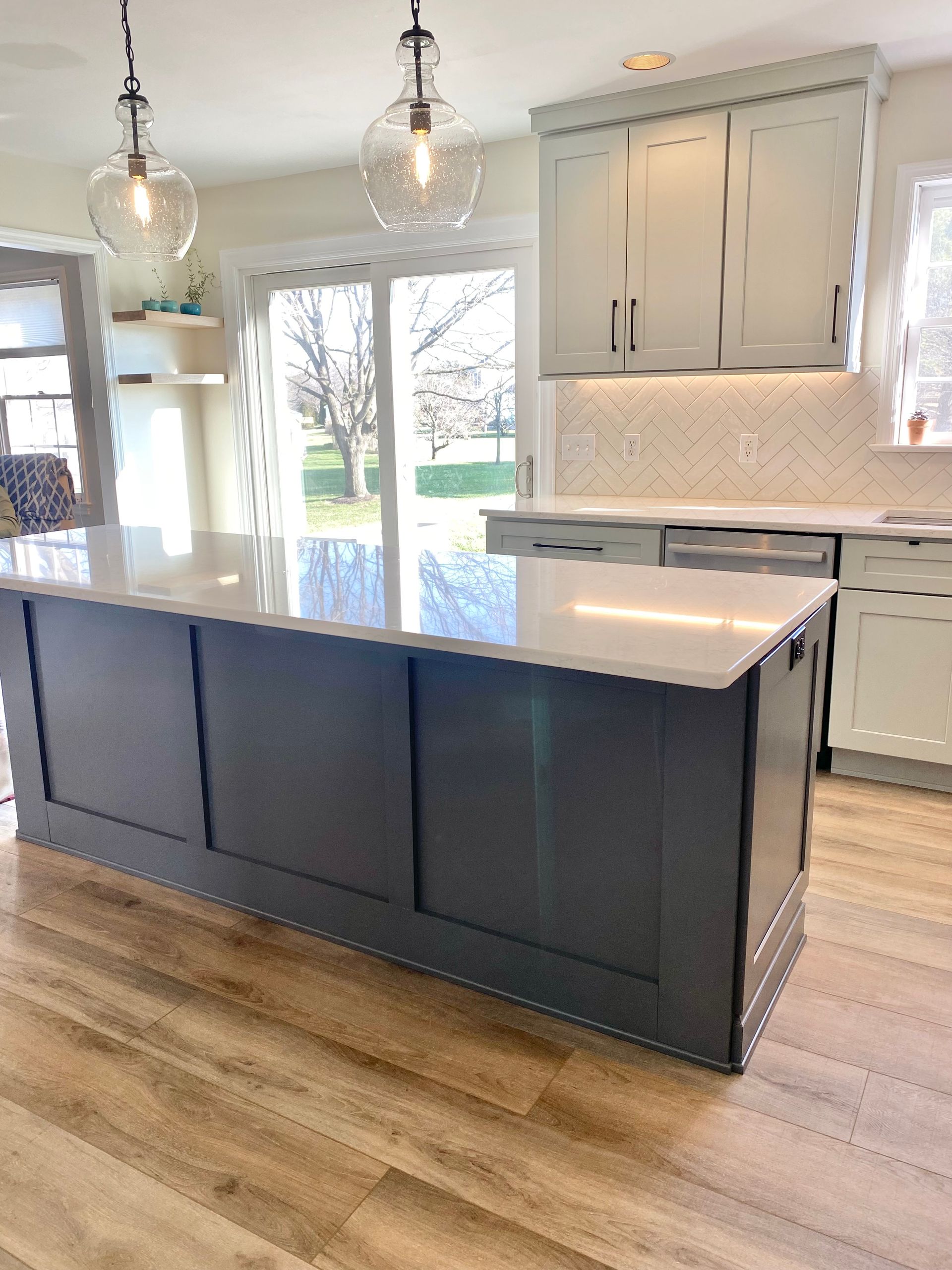 beautiful kitchen with a large island design by CM Design Interiors