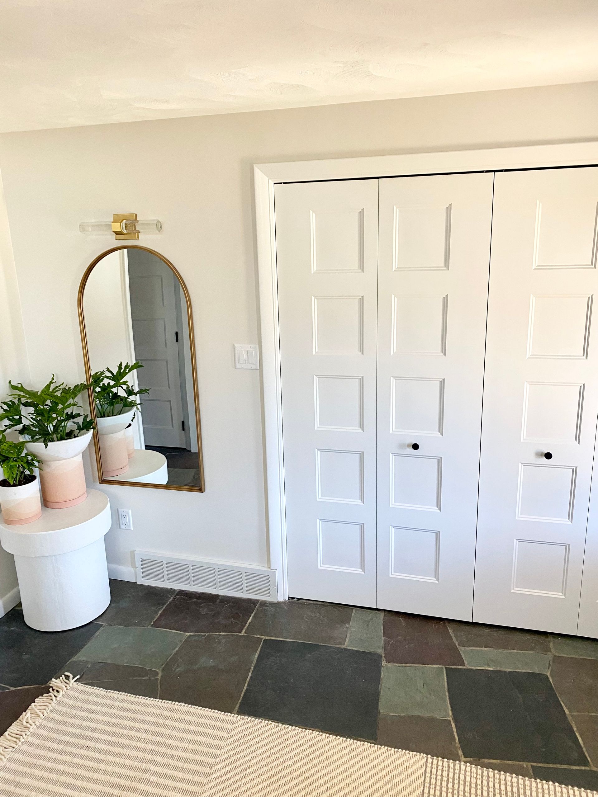 Entryway design with closet space and decor