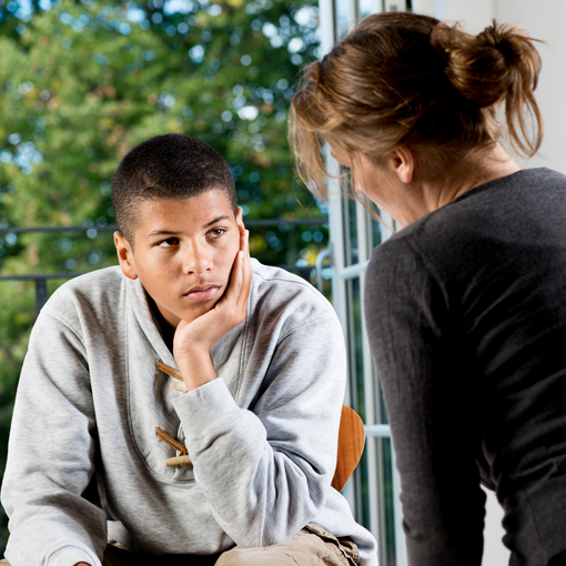 young man talking to female practitioner