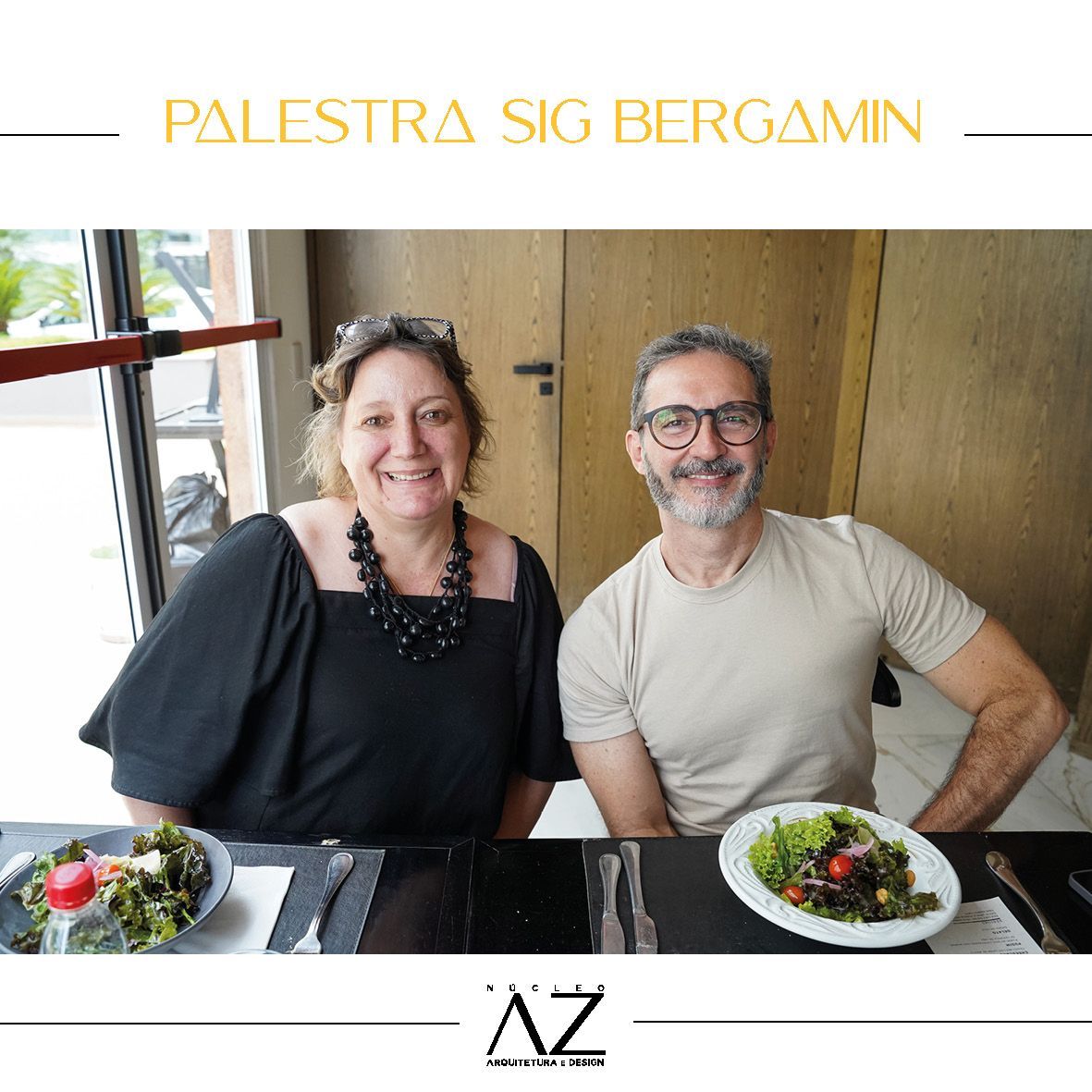 Um homem e uma mulher estão sentados à mesa com pratos de comida.