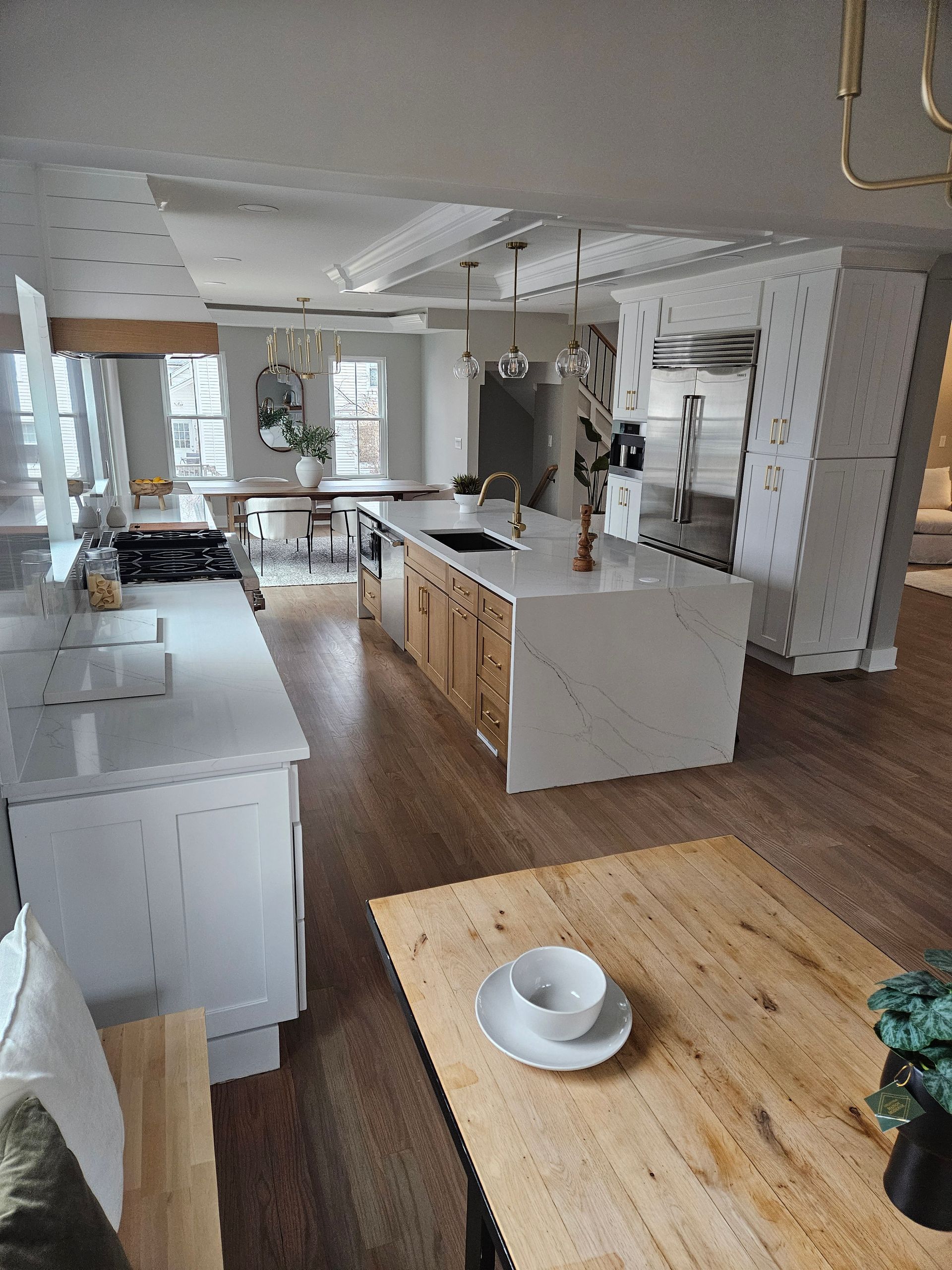 Open oven with a rack inside, in a white kitchen setting.
