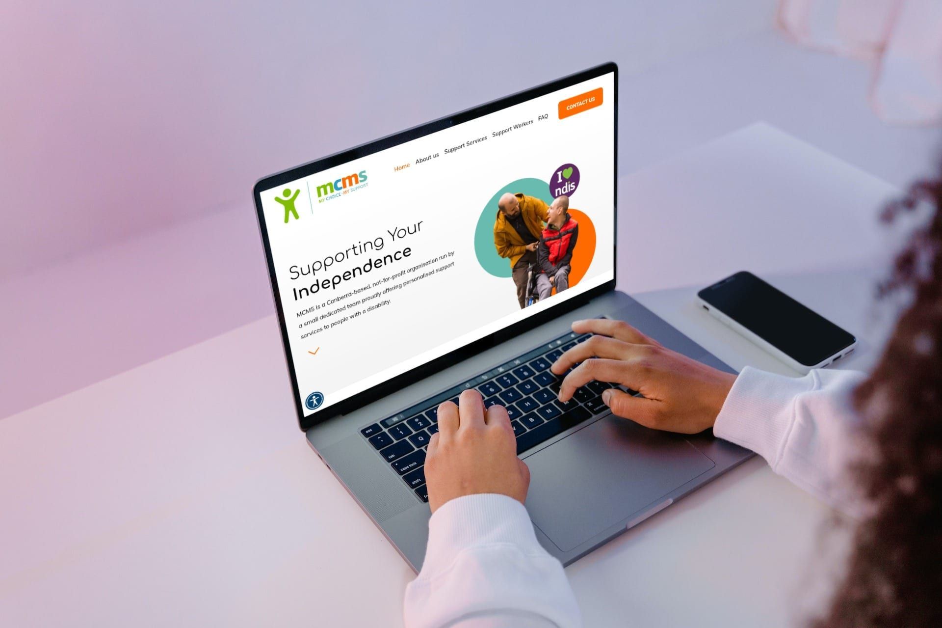 a person is typing on a laptop computer .