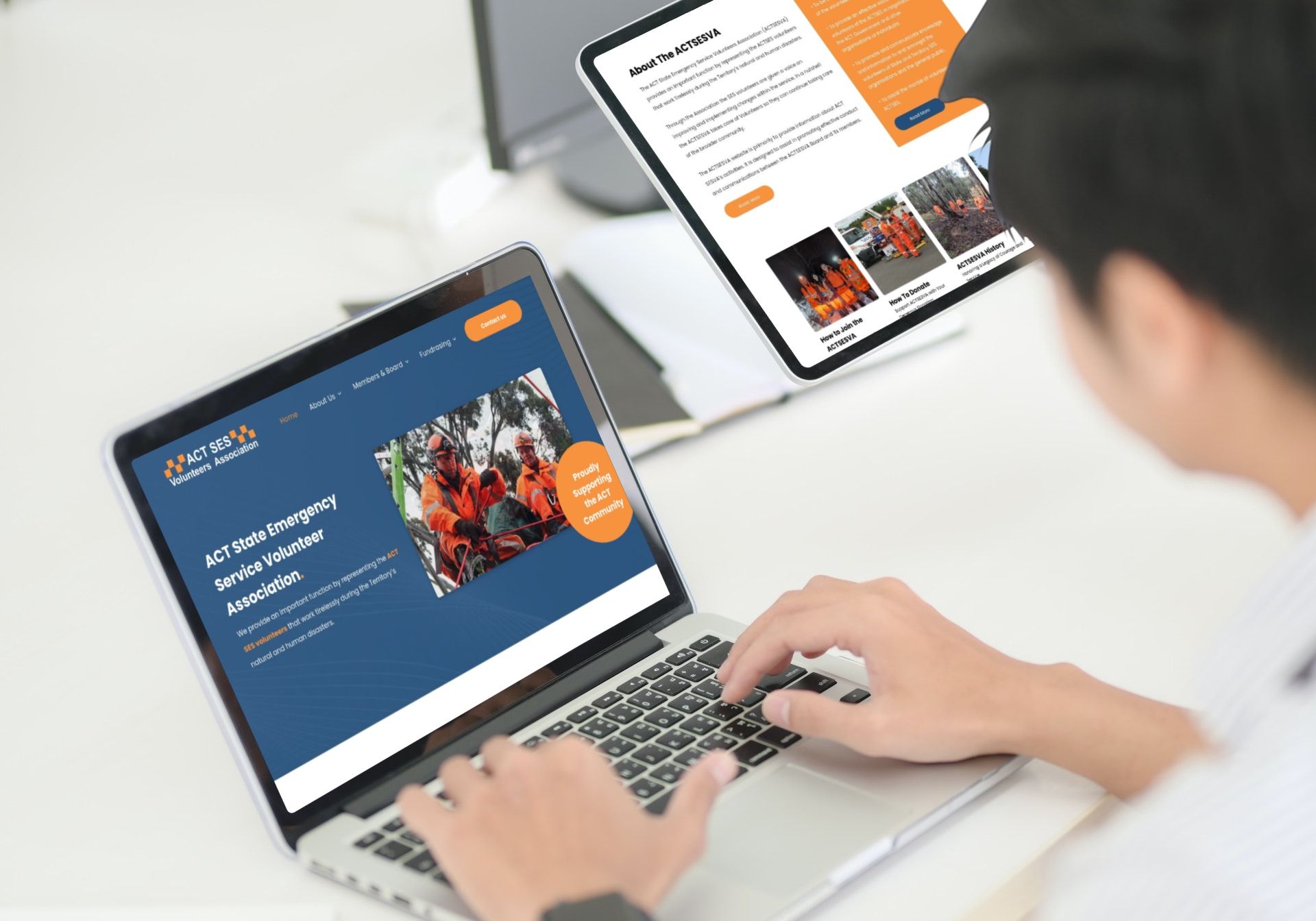 a man is using a laptop computer and a tablet computer .