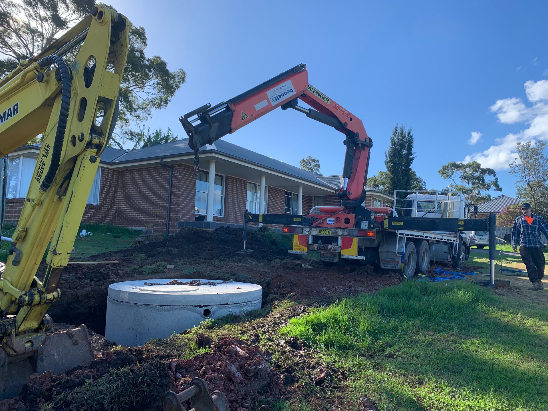 A Septic Tank Is Sitting In The Middle Of A Lush Green Yard — Bennett's Environmental In South Nowra, NSW