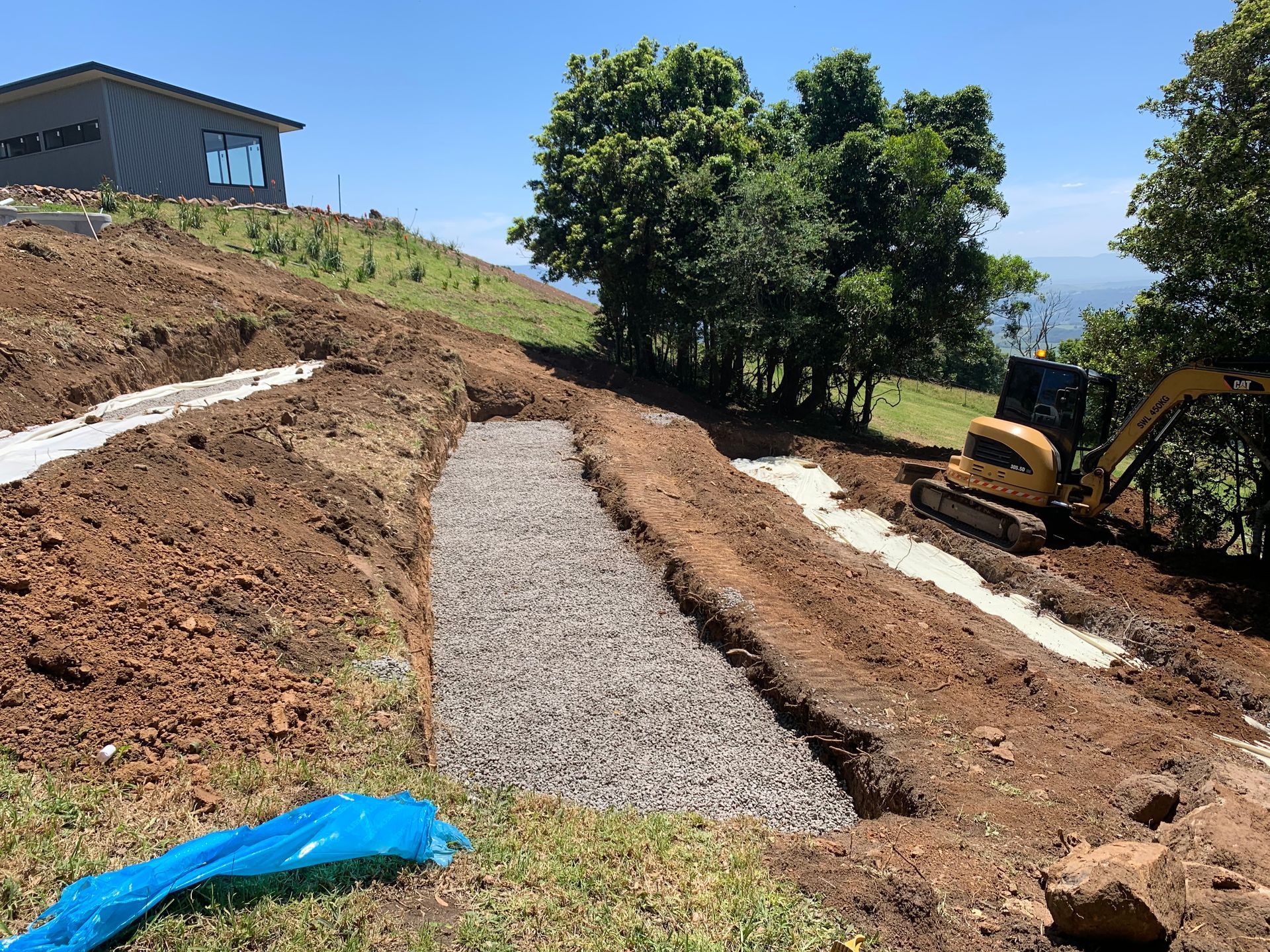 A Pile Of Gravel Is Being Loaded Into A Truck — Bennett's Environmental In Wollongong, NSW
