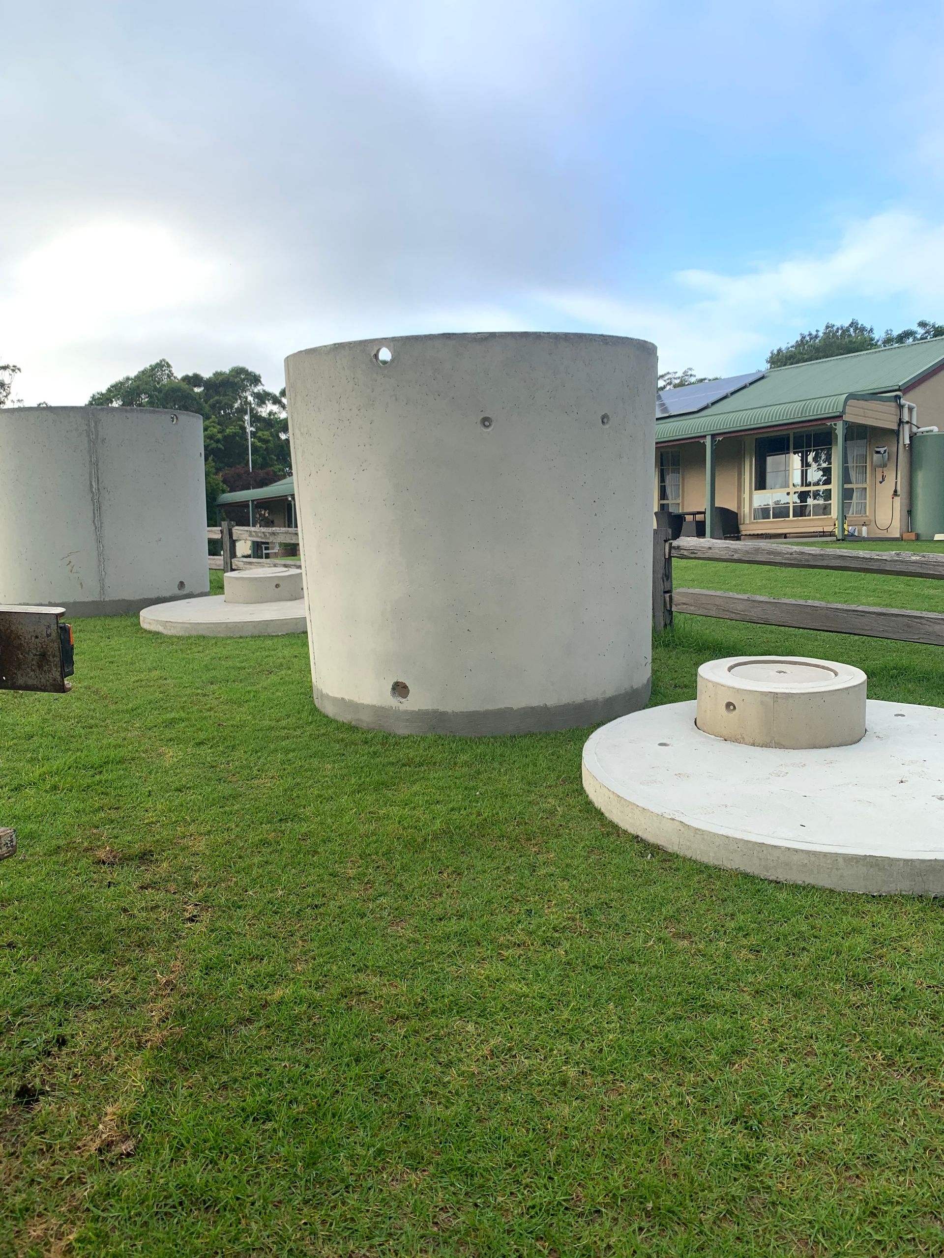 A Truck Is Carrying Concrete Blocks On A Flatbed Trailer — Bennett's Environmental In South Nowra, NSW