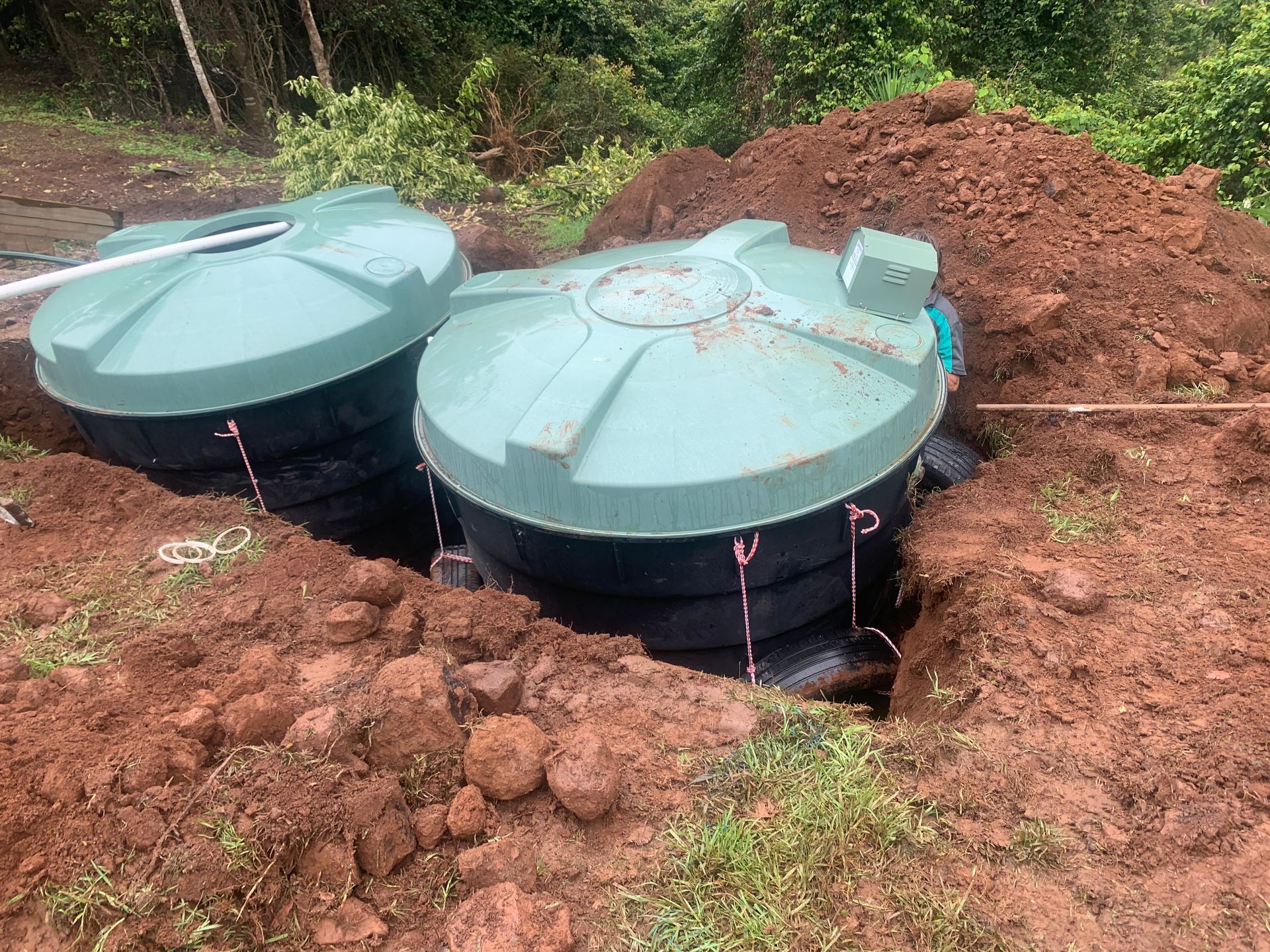 A Man Is Plowing A Field With A Tractor — Bennett's Environmental In Mittagong, NSW