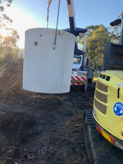 Crane Holding Septic Tank Up To Move — Bennett's Environmental In South Nowra, NSW