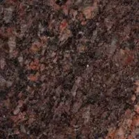 A close up of a brown granite counter top.