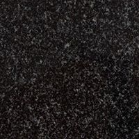 A close up of a black granite counter top.