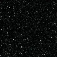 A close up of a black surface with white dots on it.