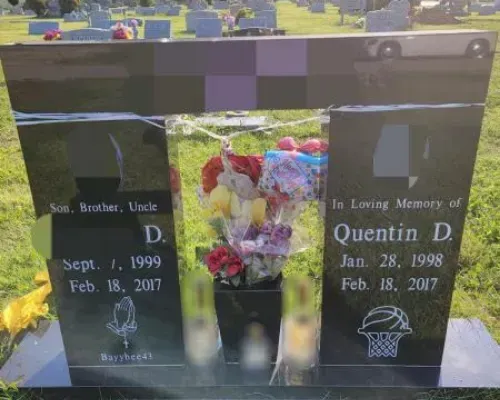 A gravestone for quentin d. is in a cemetery