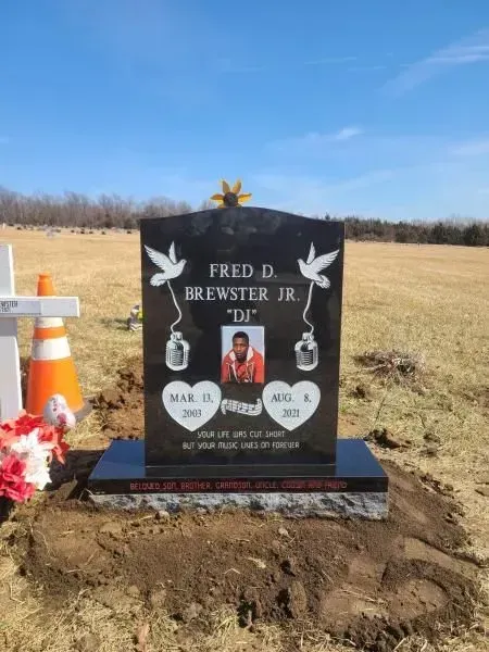 A gravestone for fred d. brewster jr. 