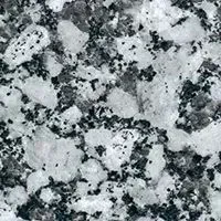 A close up of a black and white granite surface.