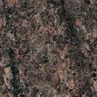 A close up of a brown granite counter top.