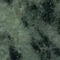 A close up of a green granite counter top.
