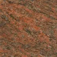 A close up of a red granite counter top.