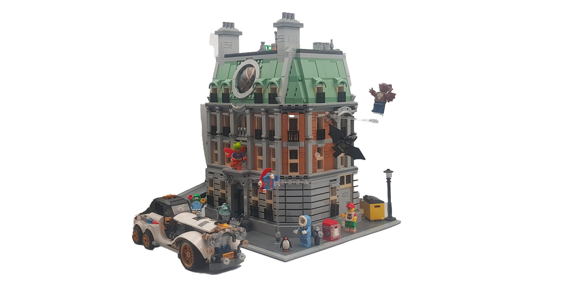 Construction en Lego d'une maison de ville avec une voiture, une rue et des minifigurines.