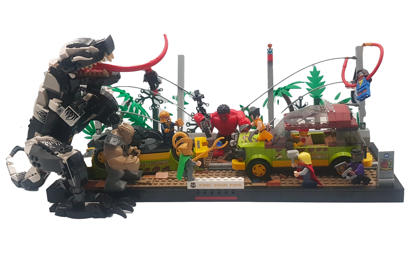 Scène Lego : Venom attaque une jeep de Jurassic Park. De nombreuses minifigurines et un gorille sont présents dans un décor de jungle.
