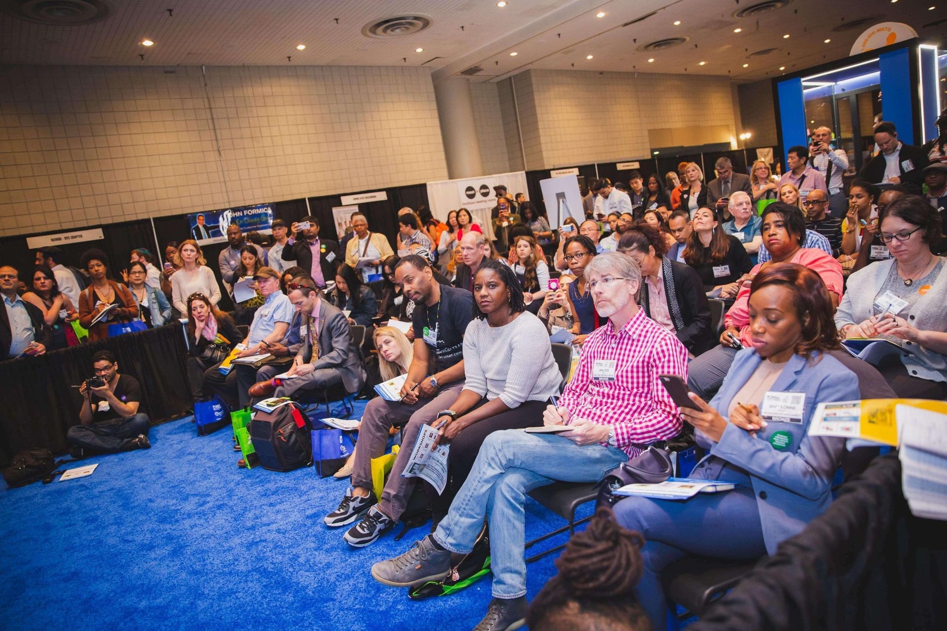 A large group of people are sitting in a room.