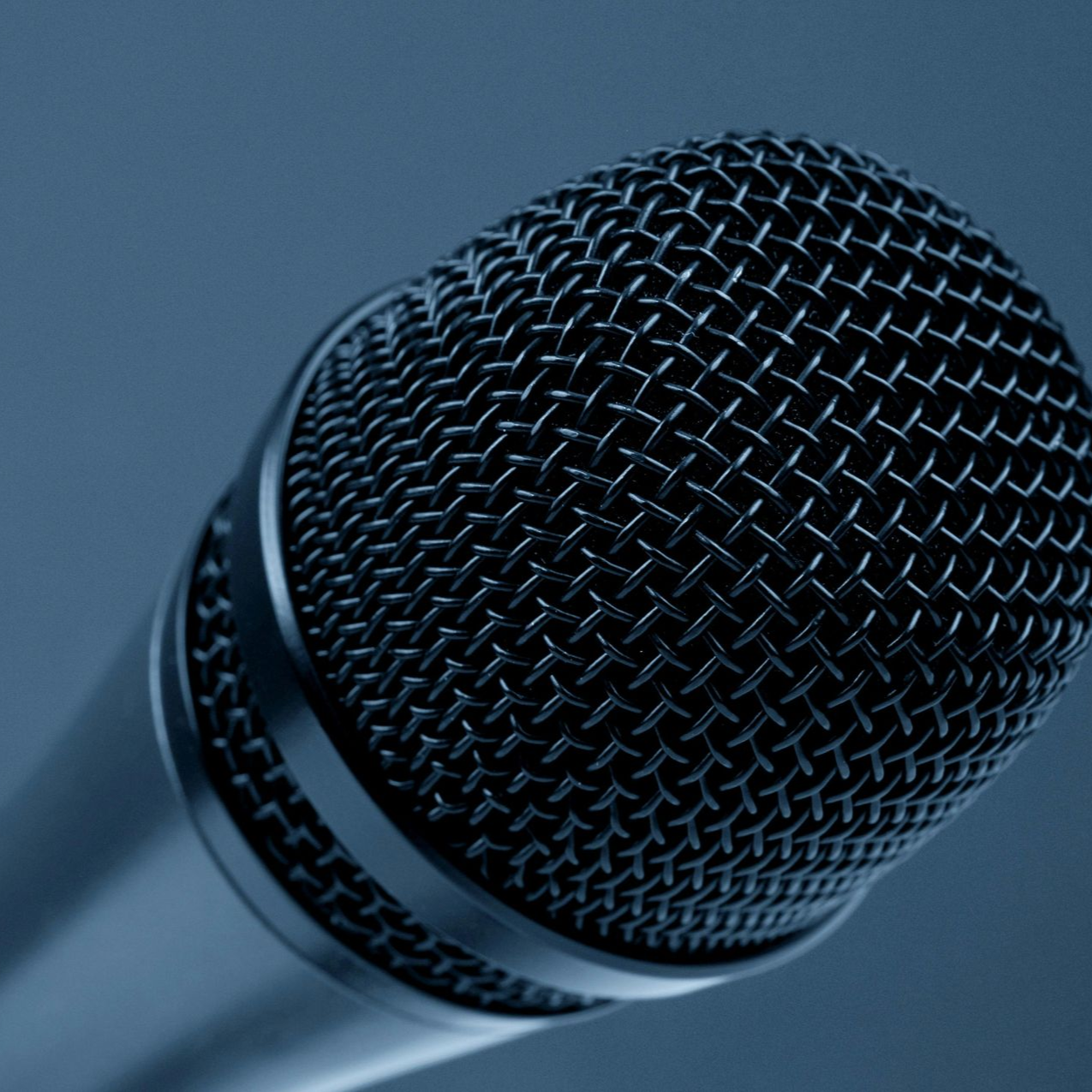 Person carrying a black speaker labeled 