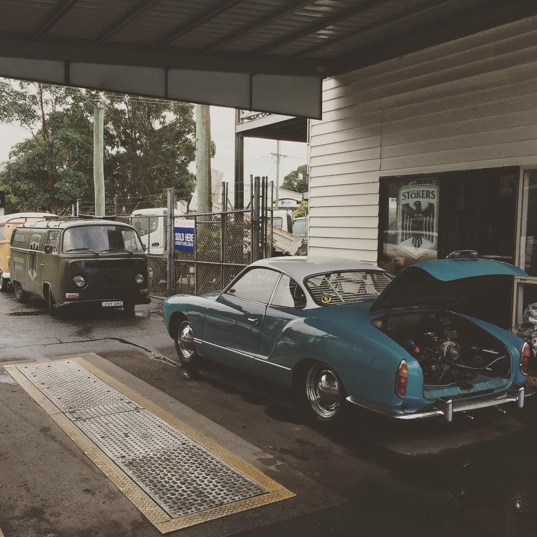 A Blue Car is Parked in Front of a Building With the Hood Open — Stokers VW Mechanical Servicing & Repairs in Byron Bay, NSW