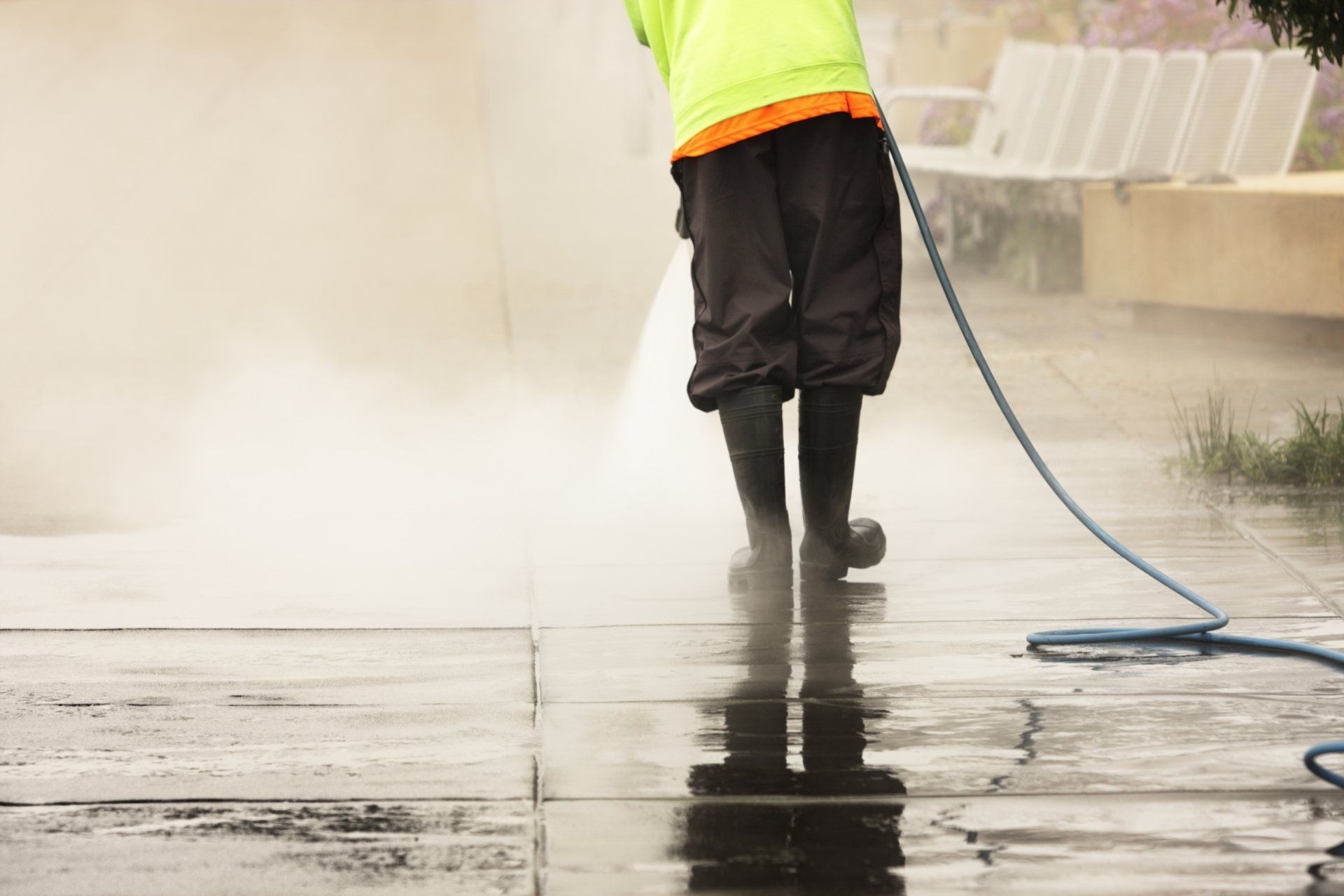 Worker Steam Cleans Sidewalk — Farmingdale, NJ — Guardian Power Cleaning