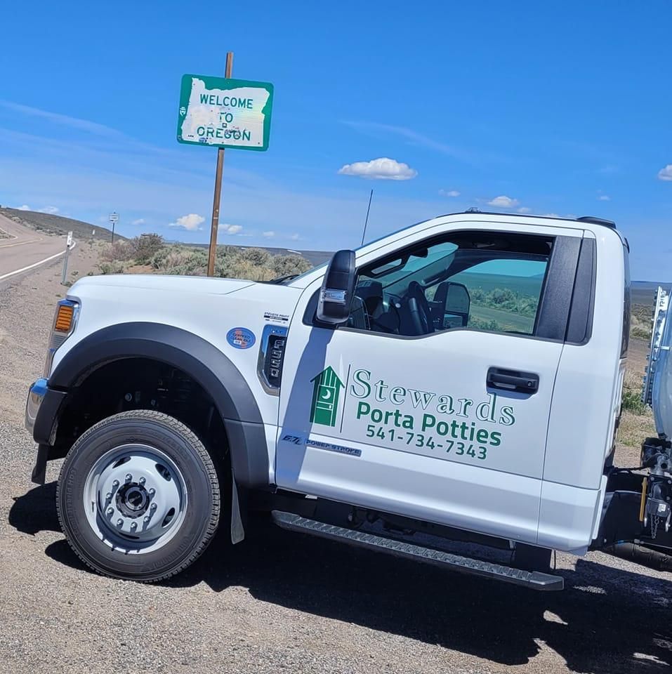 White truck with business name 