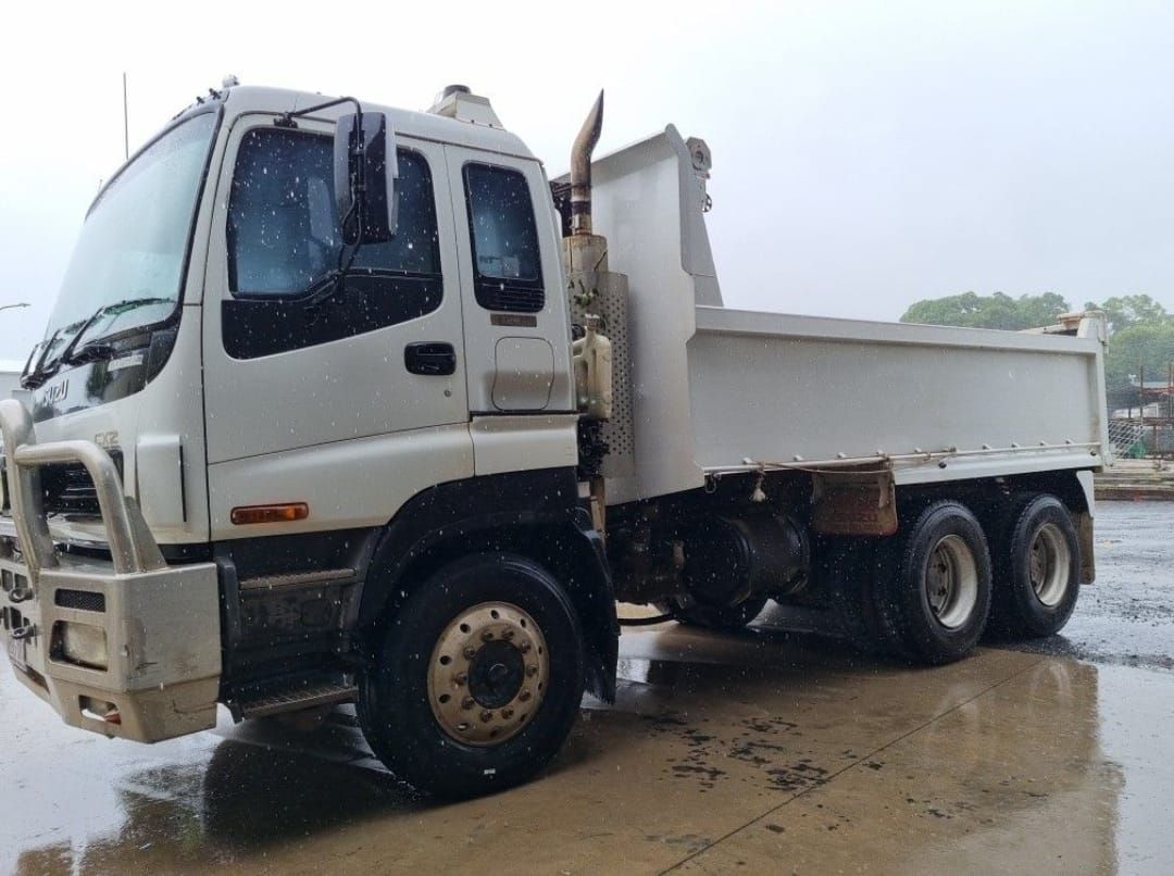 A Dump Truck Is Parked In A Dirt Field — Eclipse Hire In Edmonton, QLD