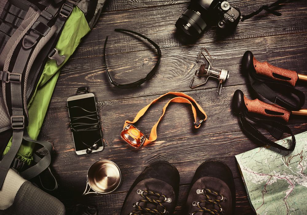 A Green Backpack Is Sitting On Top Of A Rocky Hill — Eclipse Hire In  Cairns, QLD