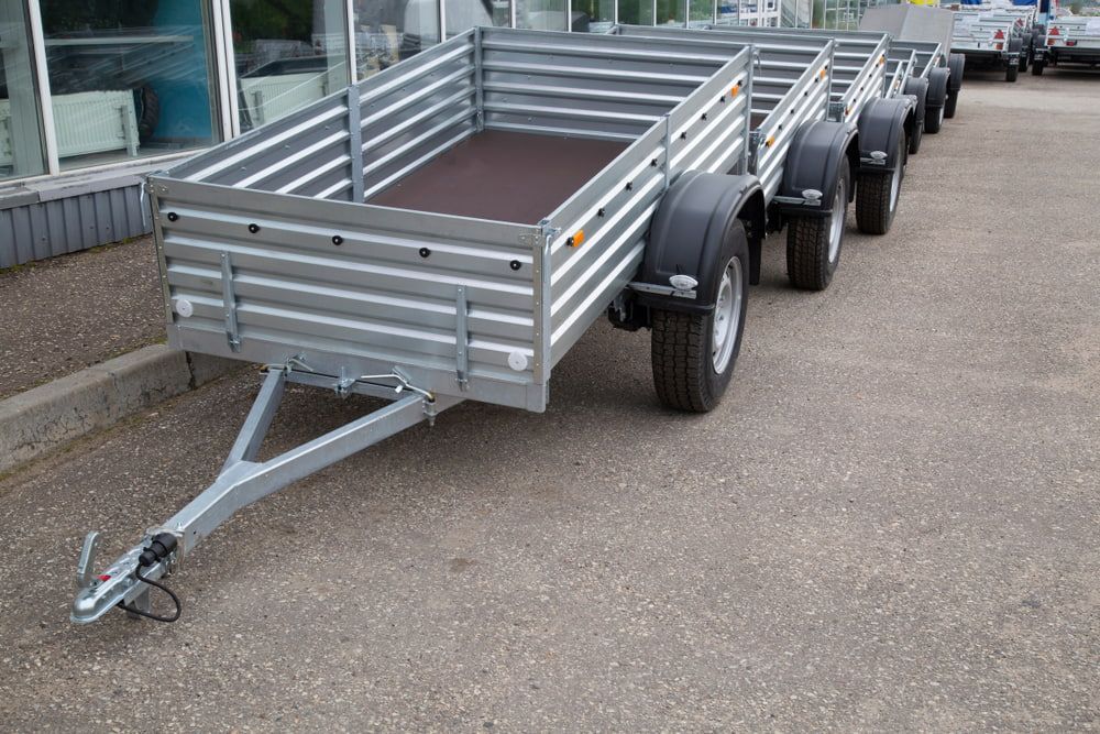 A Row Of Trailers Are Parked In A Parking Lot — Eclipse Hire In Tablelands, QLD