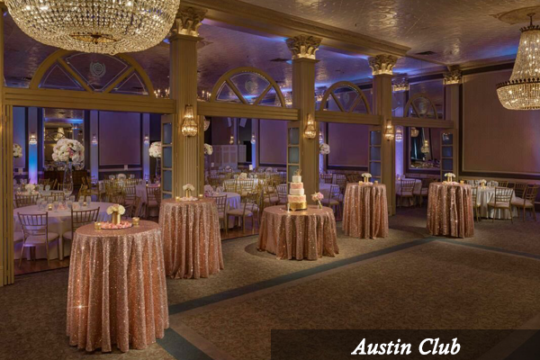 A large room with tables and chairs and the words austin club on the bottom