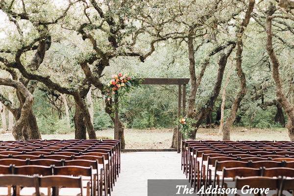 Rows of wooden chairs are lined up for a wedding ceremony at the addison grove