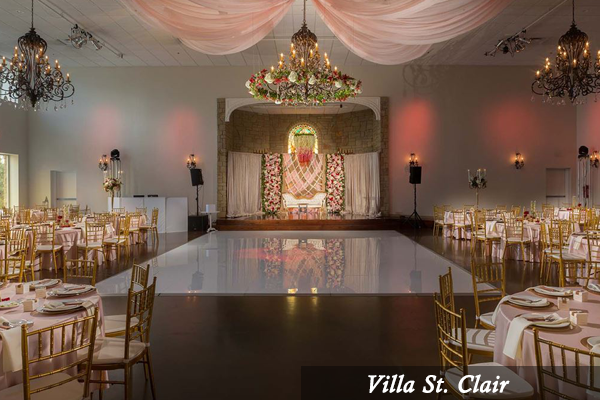 A large room with tables and chairs and a dance floor