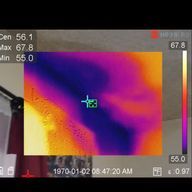 Thermal image of a person's arm, showing temperature variations in purple, orange, and red.