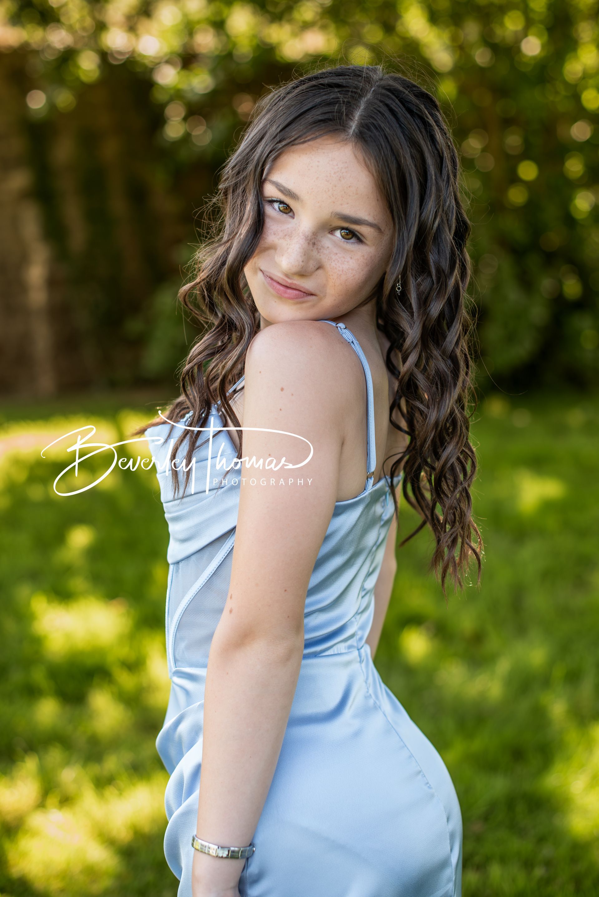 Girl wearing a blue dress at a Year 6 school prom photographed in Pembrokeshire 