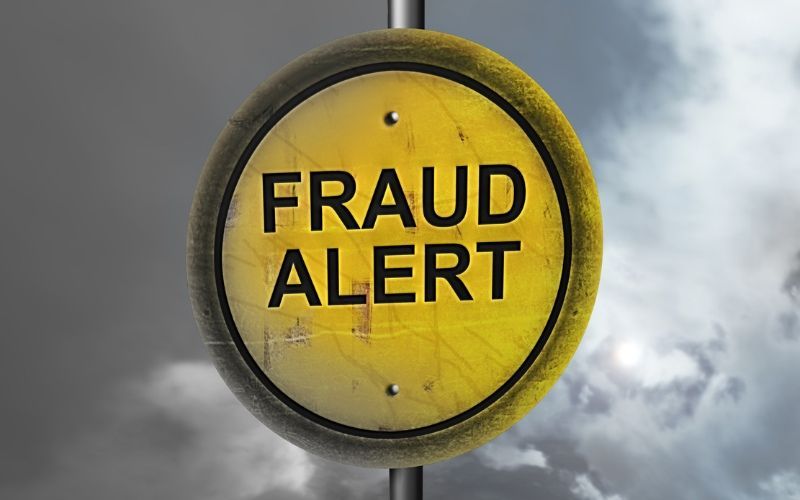 A sign that says fraud alert emphasizes What To Do If You Fall Victim To Credit Card Fraud