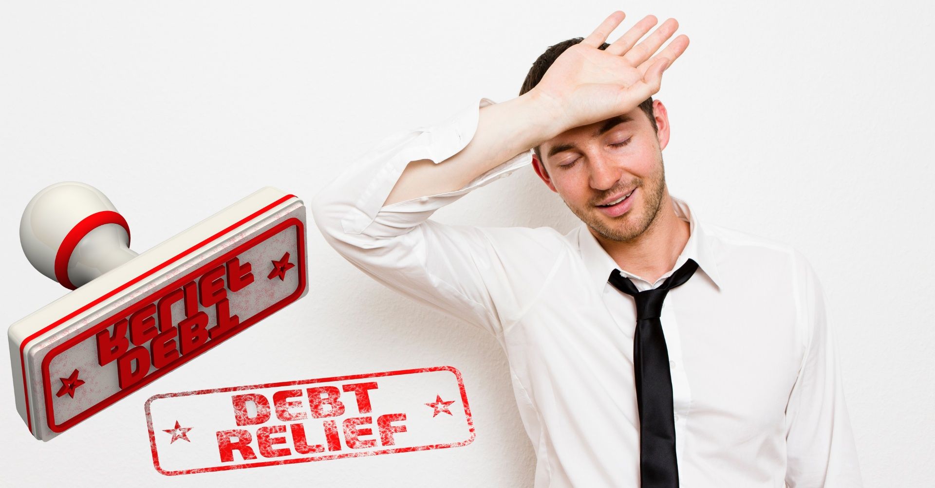 A man, visibly stressed, seeking debt relief as he wipes sweat from his forehead .