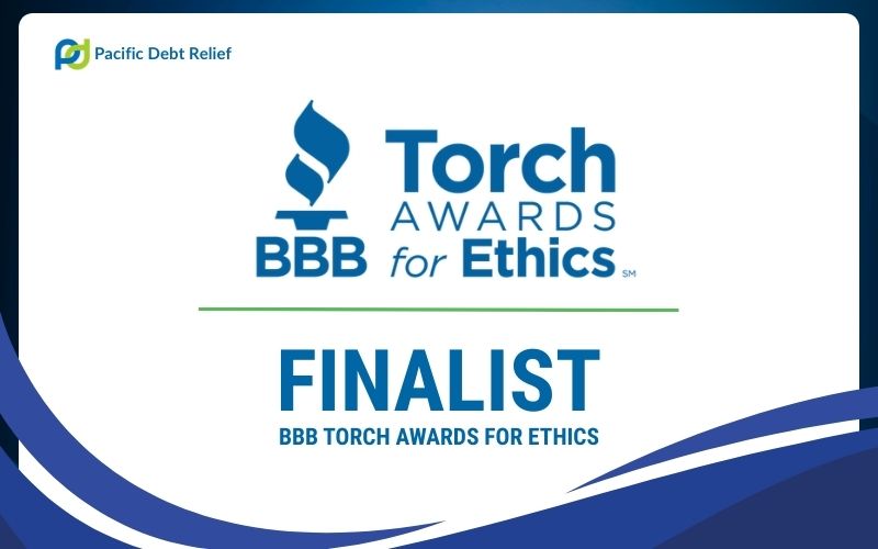 Pacific Debt Relief 2026 BBB Torch Awards for Ethics Finalist badge framed with navy blue border and
