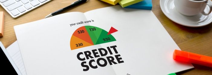A book is open to a page that says `` credit score.