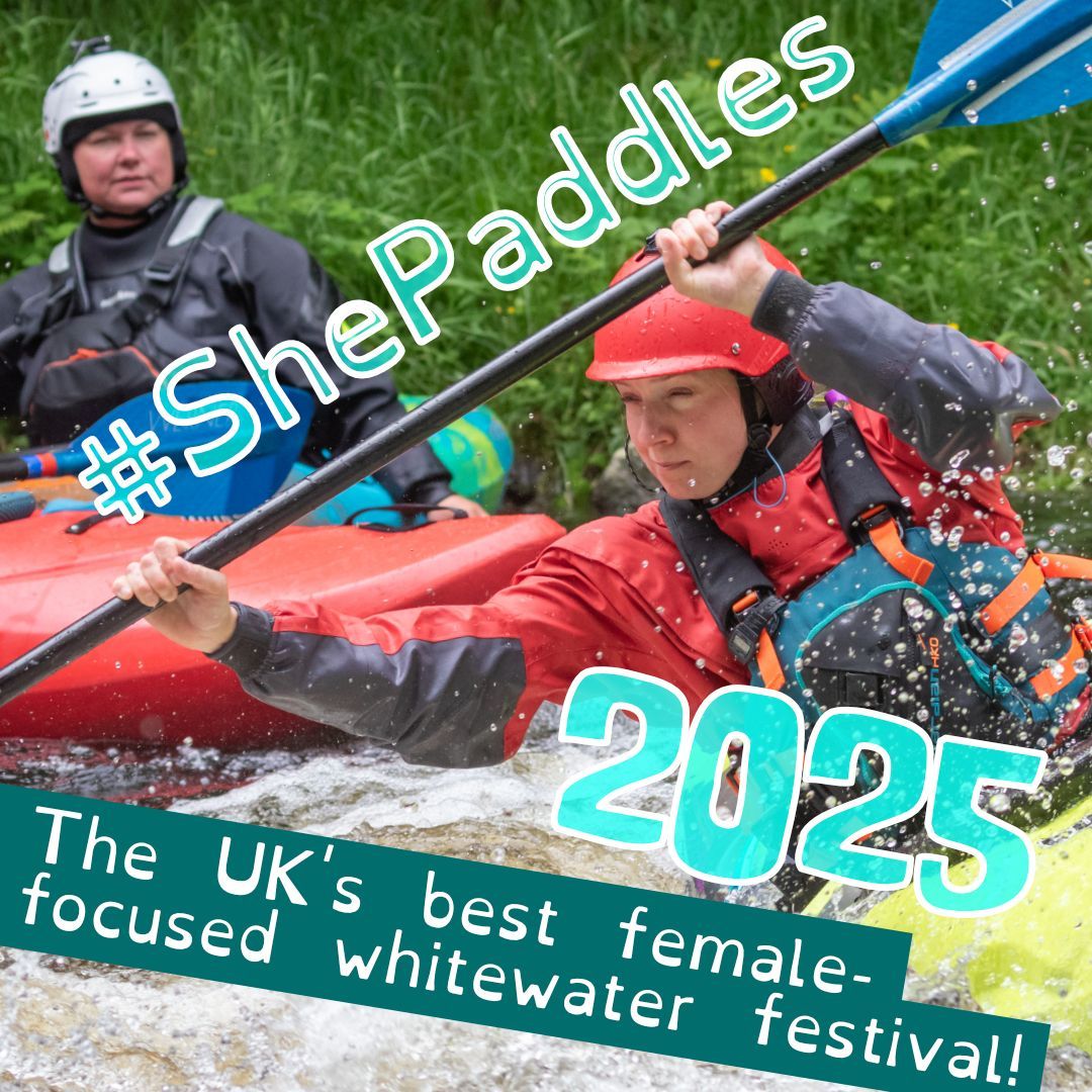 A female kayaker concentrates as she leans into a rapid, watched over by a woman coaching her.
The caption reads '#ShePaddles 2025. The UK's best female-focused whitewater festival!'