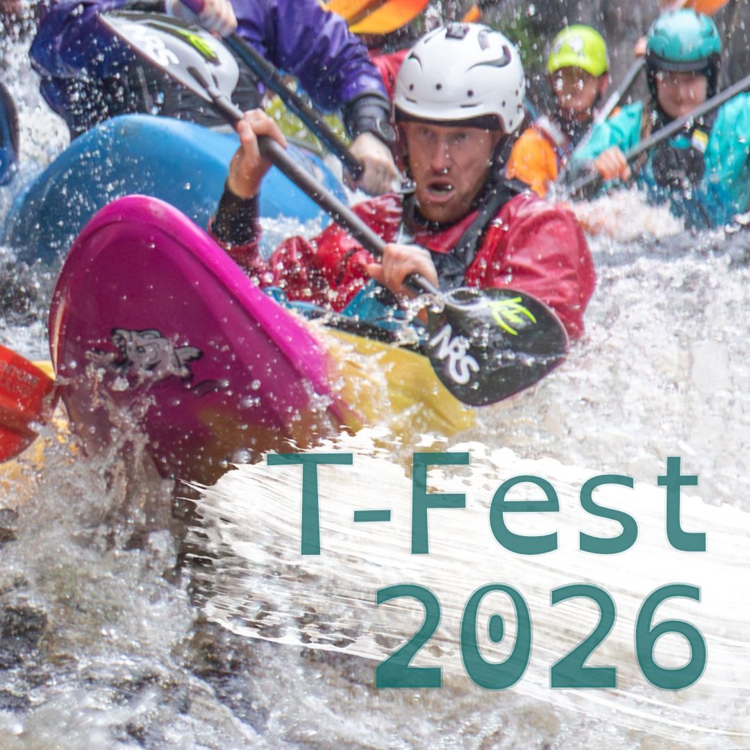 A large number of kayakers battle to be in front of each other, punching through rapids, with concentration and energy. They are dressed in brightly coloured PPE.
One kayaker bursts through the caption 'T-Fest 2026'.