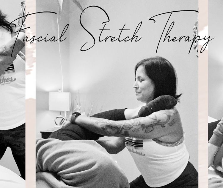 A woman is doing fascial stretch therapy on a man