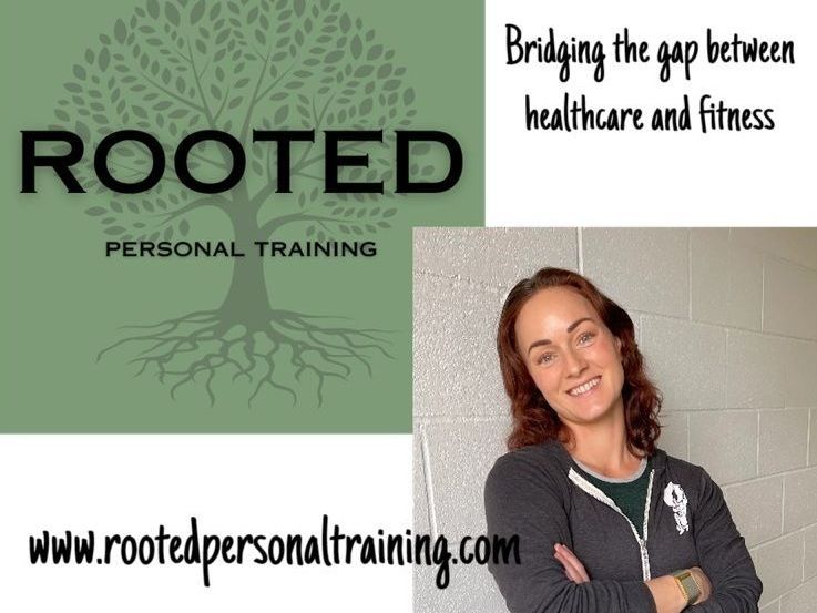 A woman stands in front of a rooted personal training logo