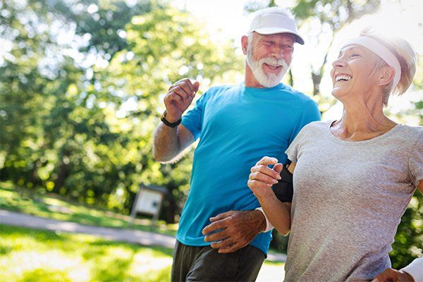 Mature Couple Jogging — Woodland, CA — Jack Cramer Insurance
